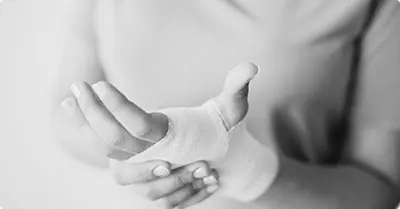 Person holding an injured wrist