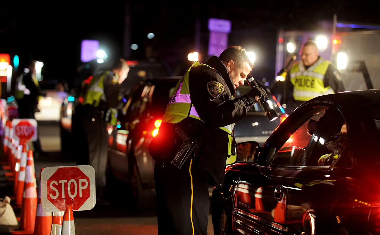 Police conducting a nighttime DUI checkpoint