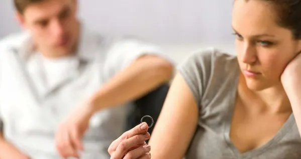 Separated couple seated apart